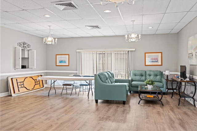600 Domenico Cir Unit G9, Saint Augustine, FL 32086 - living area featuring a chandelier, wood finished floors, and a drop ceiling