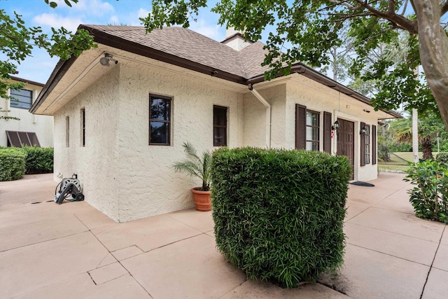600 Domenico Cir Unit G9, Saint Augustine, FL 32086 - view of side of home with stucco siding and a patio area