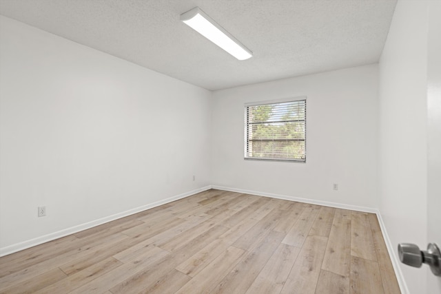 600 Domenico Cir Unit G9, Saint Augustine, FL 32086 - unfurnished room with light wood-style floors and a textured ceiling
