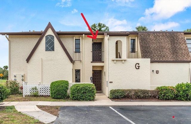 600 Domenico Cir Unit G9, Saint Augustine, FL 32086 - view of front of house featuring stucco siding, uncovered parking, and roof with shingles