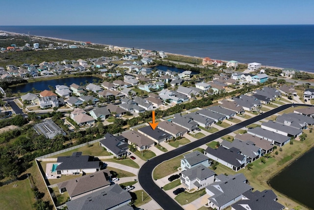 bird's eye view with a residential view and a water view