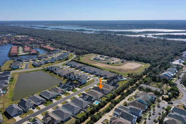 birds eye view of property with a residential view and a water view