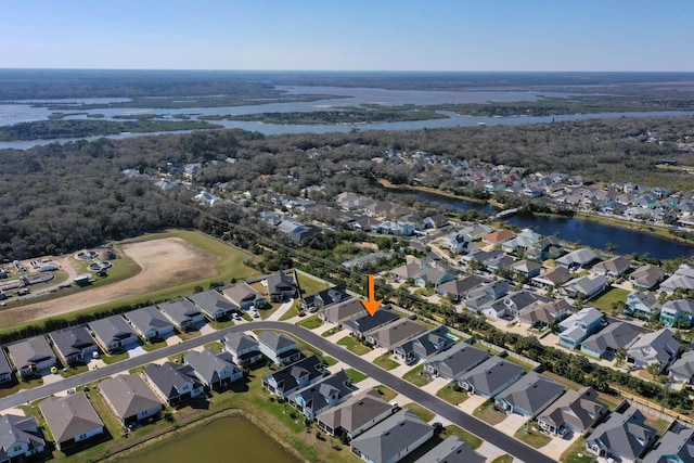 bird's eye view featuring a water view and a residential view