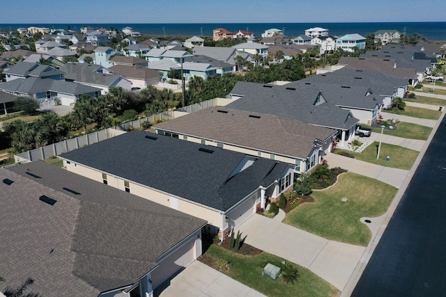 birds eye view of property featuring a water view and a residential view