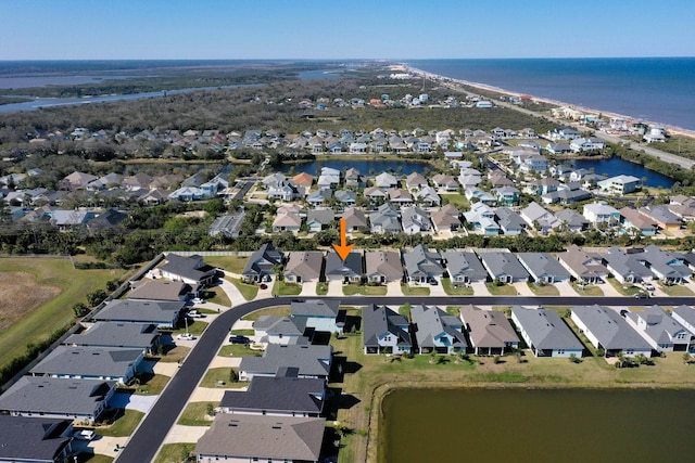 bird's eye view with a water view and a residential view