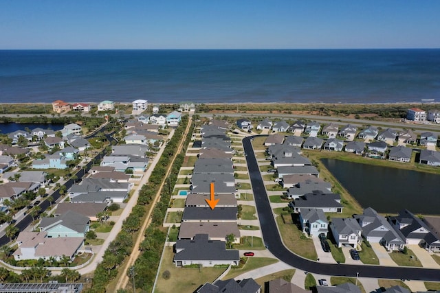 bird's eye view featuring a water view and a residential view