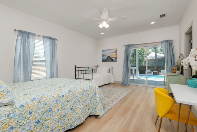 bedroom with access to outside, ceiling fan, and hardwood / wood-style flooring