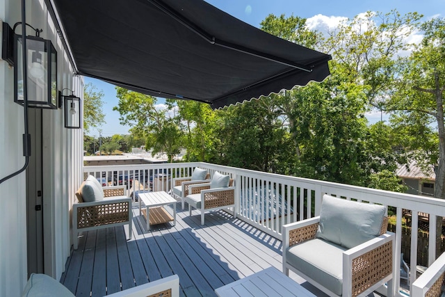 deck featuring outdoor lounge area