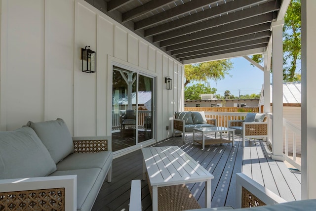 wooden terrace featuring an outdoor hangout area