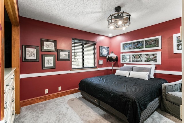 carpeted bedroom with a textured ceiling