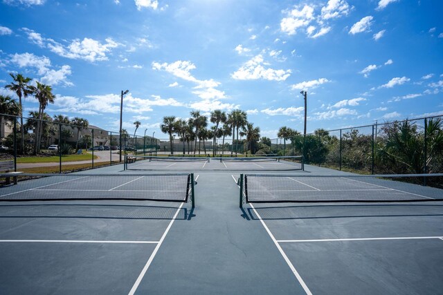 view of sport court with fence