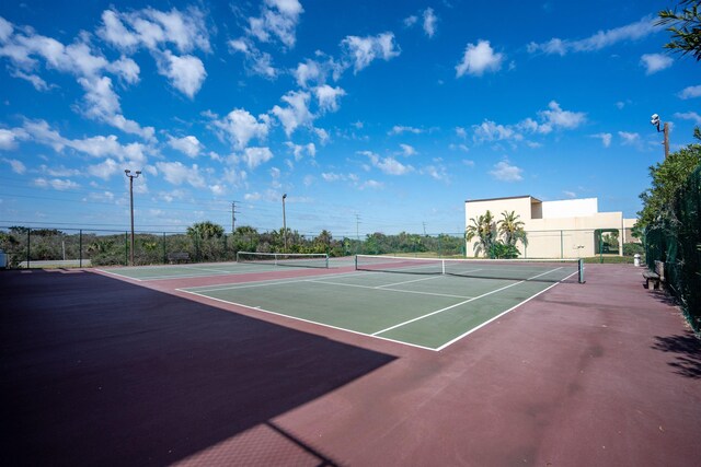 view of sport court featuring community basketball court and fence