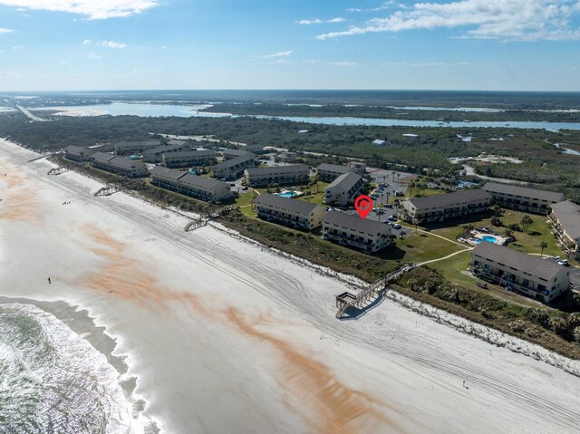 aerial view with a water view and a view of the beach