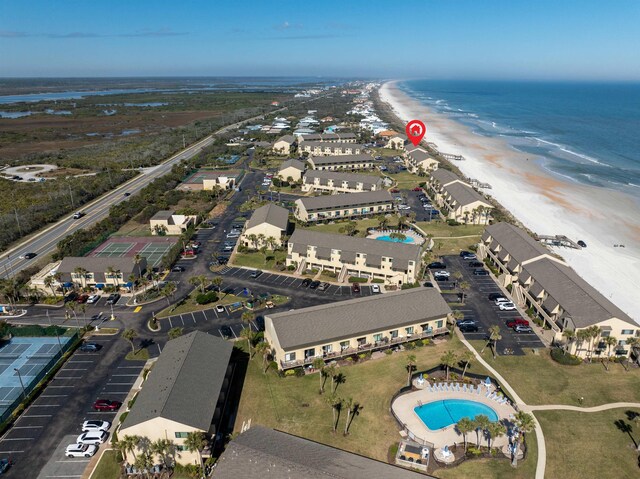 birds eye view of property featuring a view of the beach and a water view