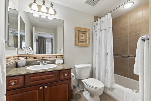 full bathroom featuring shower / tub combo with curtain, vanity, toilet, and tile patterned floors