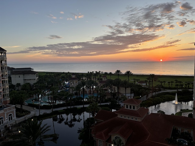 aerial view at dusk with a water view