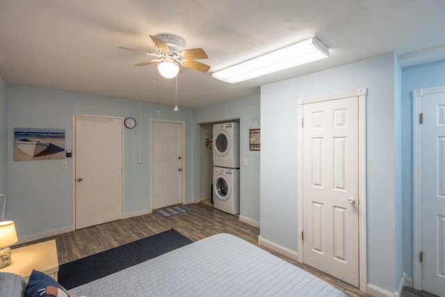 8200 S A1A Unit 15, Saint Augustine, FL 32080 - bedroom with stacked washer / dryer, wood finished floors, and a ceiling fan