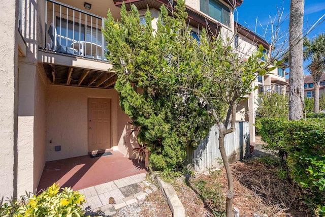 8200 S A1A Unit 15, Saint Augustine, FL 32080 - property entrance with stucco siding and a balcony