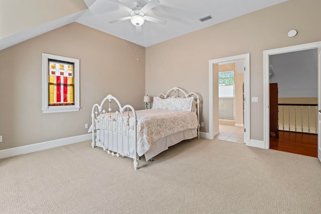 821 Kalli Creek Ln, Saint Augustine, FL 32080 - bedroom with carpet, lofted ceiling, baseboards, ceiling fan, and connected bathroom