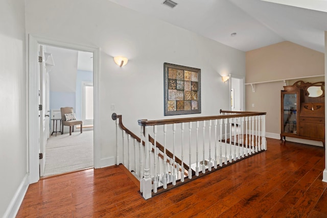 821 Kalli Creek Ln, Saint Augustine, FL 32080 - hall with an upstairs landing, wood finished floors, vaulted ceiling, and baseboards