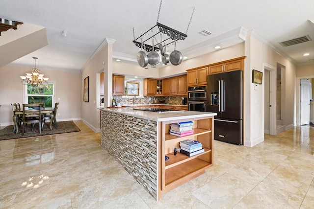 821 Kalli Creek Ln, Saint Augustine, FL 32080 - kitchen featuring high end black fridge, a chandelier, crown molding, stainless steel double oven, and brown cabinets