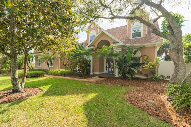 821 Kalli Creek Ln, Saint Augustine, FL 32080 - view of front of property featuring a front lawn, stucco siding, and a shingled roof