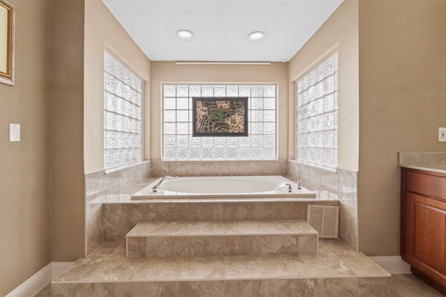 821 Kalli Creek Ln, Saint Augustine, FL 32080 - bathroom with healthy amount of natural light, a garden tub, vanity, and recessed lighting