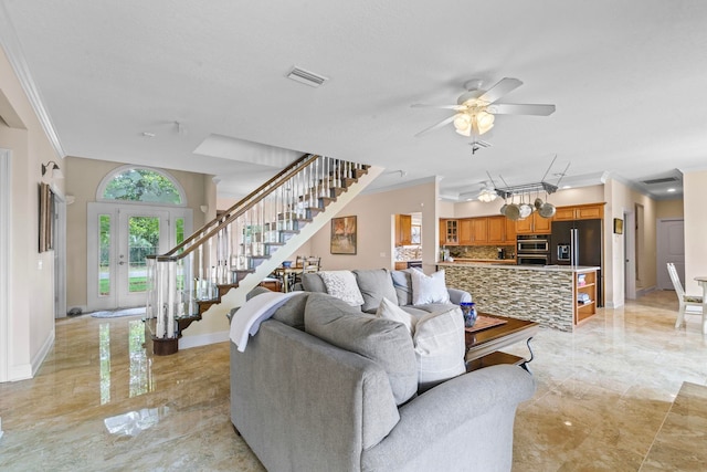 821 Kalli Creek Ln, Saint Augustine, FL 32080 - living area featuring crown molding, stairway, light marble finish floors, baseboards, and a ceiling fan