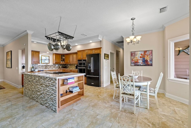 821 Kalli Creek Ln, Saint Augustine, FL 32080 - kitchen featuring black appliances, open shelves, a chandelier, brown cabinetry, and ornamental molding