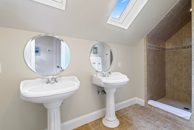821 Kalli Creek Ln, Saint Augustine, FL 32080 - full bath featuring lofted ceiling, a skylight, a tile shower, baseboards, and tile patterned flooring