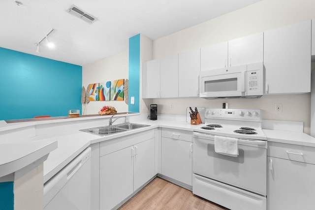 510 Florida Club Blvd Unit 301, Saint Augustine, FL 32084 - kitchen featuring white appliances, track lighting, light countertops, a sink, and light wood-type flooring