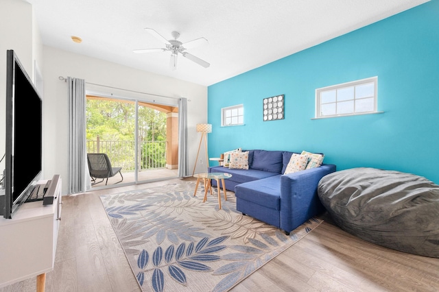 510 Florida Club Blvd Unit 301, Saint Augustine, FL 32084 - living room featuring wood finished floors, a ceiling fan, and an accent wall