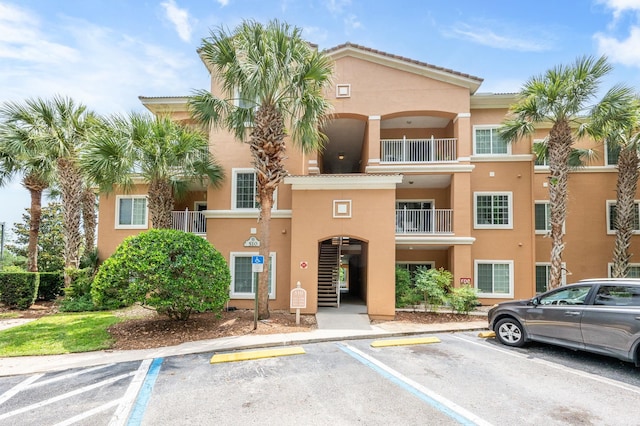 510 Florida Club Blvd Unit 301, Saint Augustine, FL 32084 - view of building exterior featuring uncovered parking