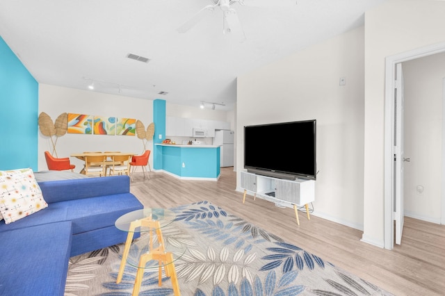 510 Florida Club Blvd Unit 301, Saint Augustine, FL 32084 - living area featuring rail lighting, light wood-style floors, baseboards, and ceiling fan