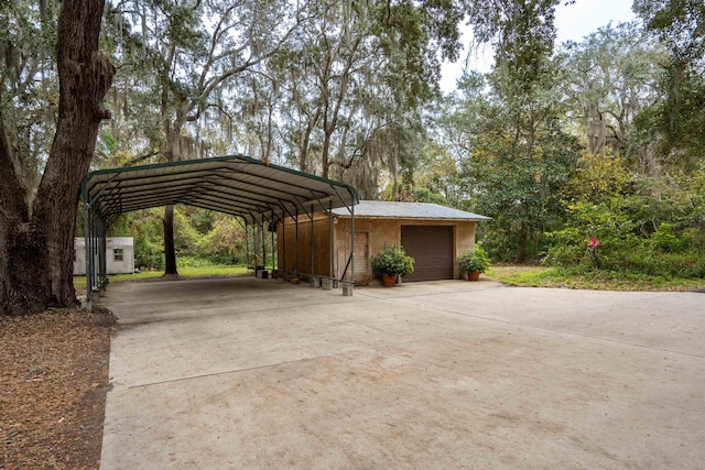 view of vehicle parking with a garage and a carport