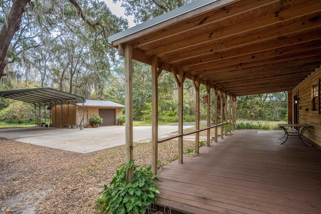 deck with an outbuilding and a carport