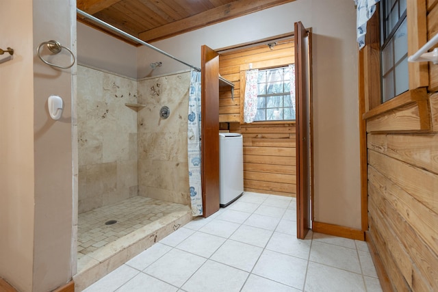 bathroom featuring wood walls, tile patterned flooring, walk in shower, washer / dryer, and wood ceiling