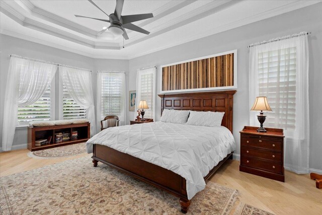 587 Pescado Dr, Saint Augustine, FL 32095 - bedroom with ornamental molding, wood finished floors, a raised ceiling, and a ceiling fan