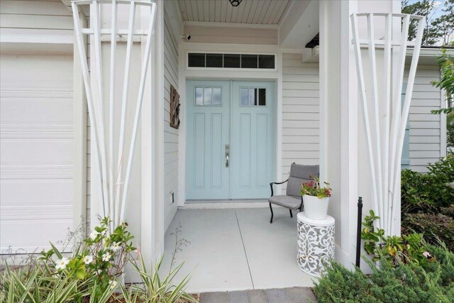 587 Pescado Dr, Saint Augustine, FL 32095 - doorway to property with a garage and covered porch