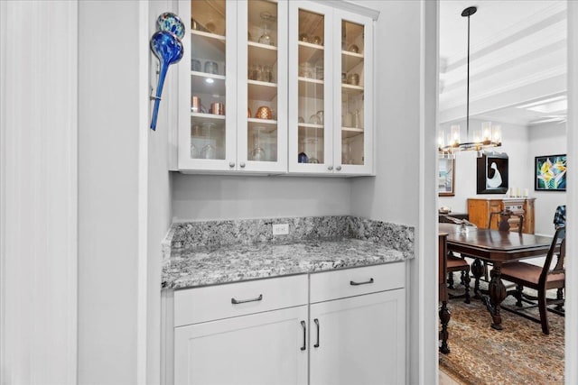 587 Pescado Dr, Saint Augustine, FL 32095 - bar with decorative light fixtures and a chandelier