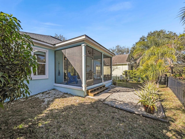 view of yard with a sunroom