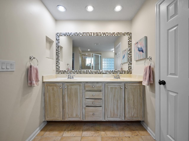 bathroom featuring vanity, tasteful backsplash, and walk in shower