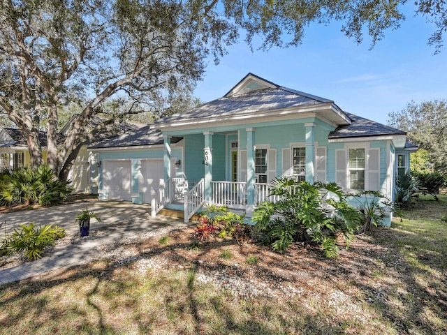 view of front facade with a garage and covered porch