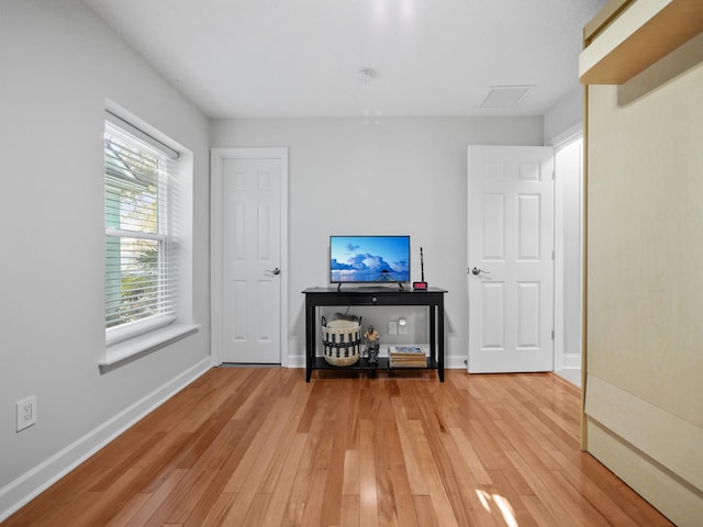 unfurnished living room featuring hardwood / wood-style flooring