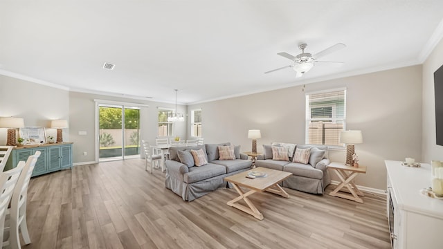 living room featuring ceiling fan, light hardwood / wood-style flooring, and ornamental molding