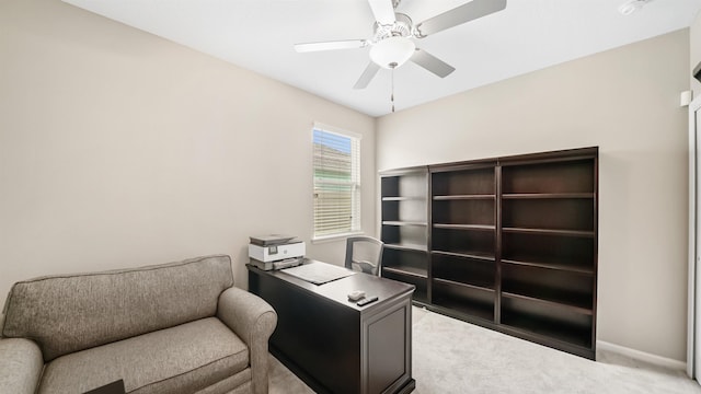 office area with light colored carpet and ceiling fan