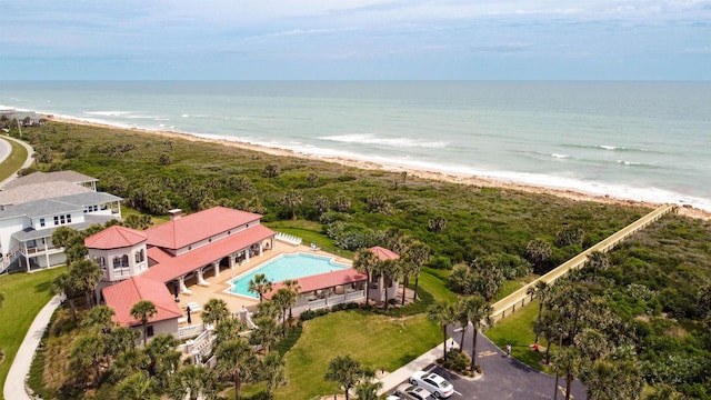 birds eye view of property featuring a view of the beach and a water view