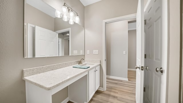 bathroom featuring vanity and hardwood / wood-style flooring