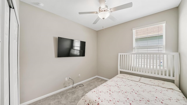 carpeted bedroom with ceiling fan