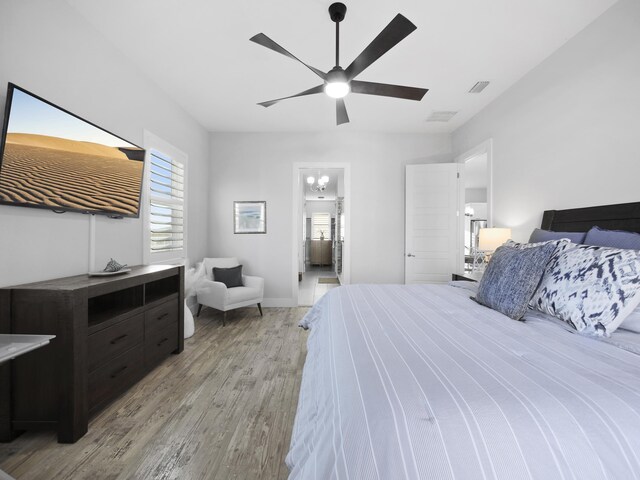 5813 Rudolph Ave, Saint Augustine, FL 32080 - bedroom with connected bathroom, a ceiling fan, light wood-type flooring, baseboards, and visible vents